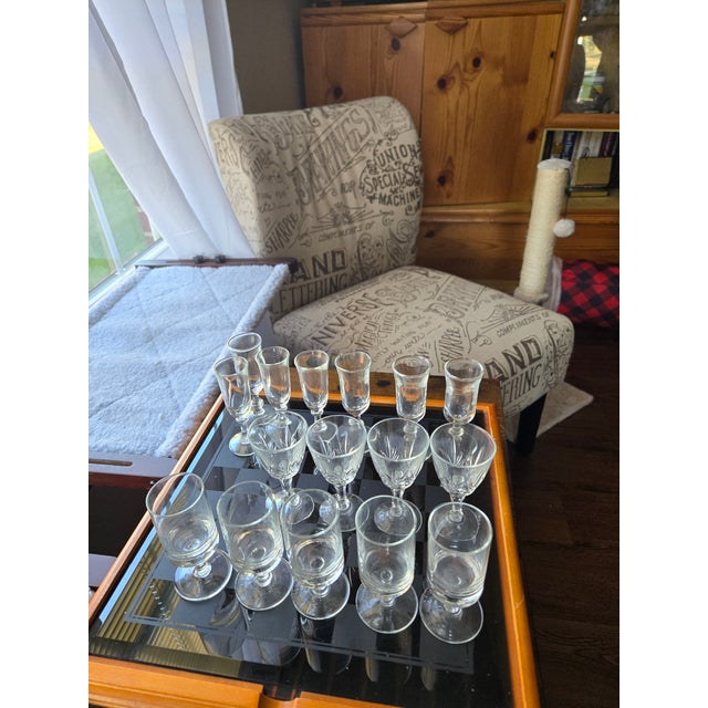 3 exquisite sets of Liqueur glasses all with their own unique shape. 1 set has 4 piece with a leaf design, 2nd set has 5...