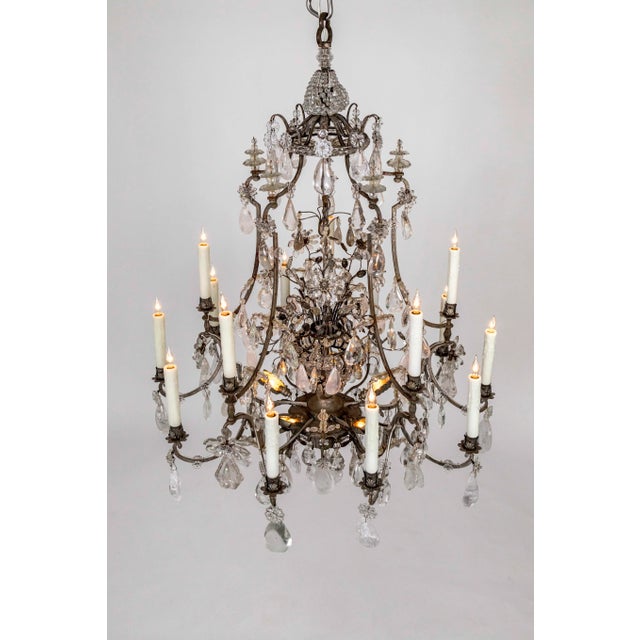 An absolutely magnificent, rare, 20-light, silver-gilded bronze, rock crystal chandelier with impeccable balance and great...