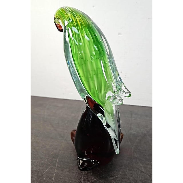 Add a sparkle of mid-century style to your interior with this exceptional vintage hand-blown art glass parrot sculpture....