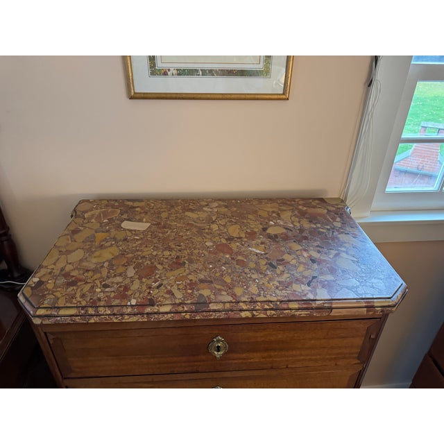 Elegant and space-efficient late 19th-century French Louis XVI–style mahogany semainier chest, topped with striking...