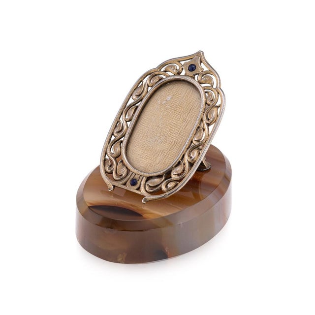 Antique 19th century french gilt solid silver photograph frame set on a polished agate base. The frame is of oval form...