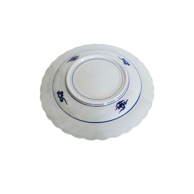 JAPANESE BLUE AND WHITE DECORATED PORCELAIN PLATE, early 20th century-the underside with impressed signature, with a...