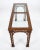 Beautifully detailed faux-bamboo console table featuring carved lattice corner blocks, decorative fretwork, and a glass-...