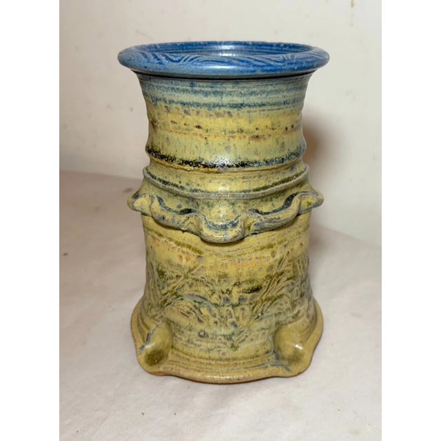 Crafted with a keen eye for detail, this vintage vase embodies the essence of brutalist art pottery. The rich yellow and...