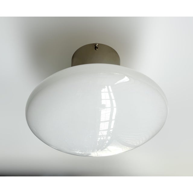 Italian flush mount with glossy white Murano glass shade and solid brass frame in polished nickel finish / Made in Italy...