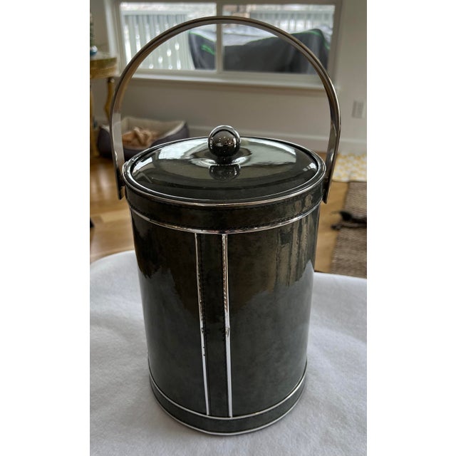 Think Mad Men! Mid-Century Modern Georges Briard tall ice bucket in gray vinyl, plastic and stainless steel. The bucket is...