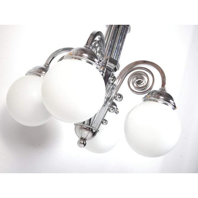 Rondocubistic Czechoslovakian 4 flame chandelier in chromed brass in excellent condition. 100 cm tall, 50 cm wide, weight...