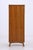 A narrow vintage wardrobe from the 1960s with a beautiful wood grain and clean proportions. The slightly splayed legs and...