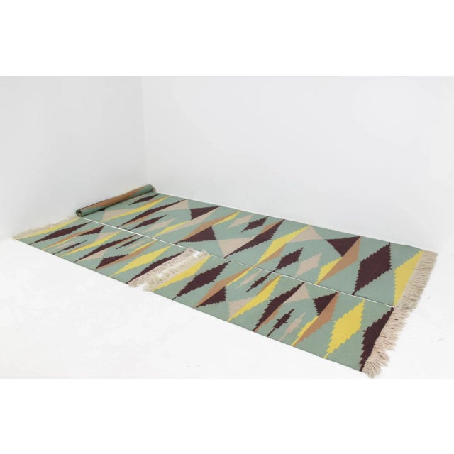 This set of mid-century rugs were produced in former czechoslovakia. They are reminiscent of the style of antonin kybal....