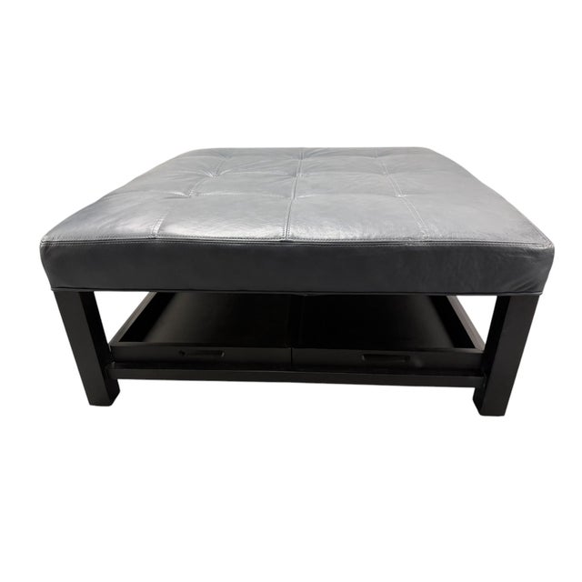 Quick Hits: - Arhaus Camden Collection Butler Leather Ottoman in Slate - Showroom sample in pristine condition - Luxurious...