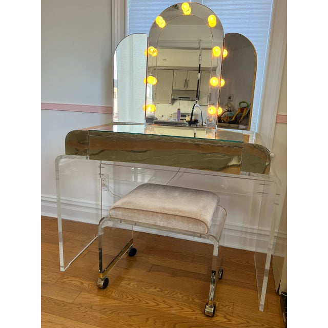 Lucite Brass Arched Vanity Mirror Set Made by Hill Manufacturing Comes with the matching lucite stool Photos are a part of...