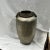 Hand hammered vase / jug with brass trim and knocker handles. Marked India. Measures 9” diameter x 17”h.