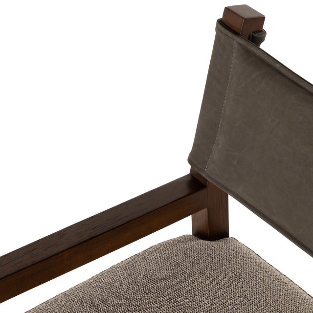 Mixed materials at their finest. Brown parawood frames squared seating of high-performance fabric. A top-grain leather...