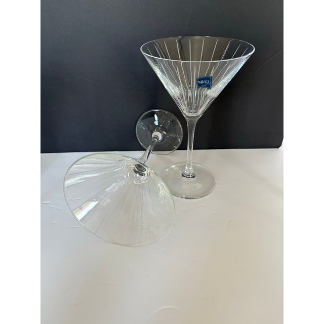 This pair of Mikasa martini glasses showcases a striking vertical line etch that emphasizes height, structure, and...