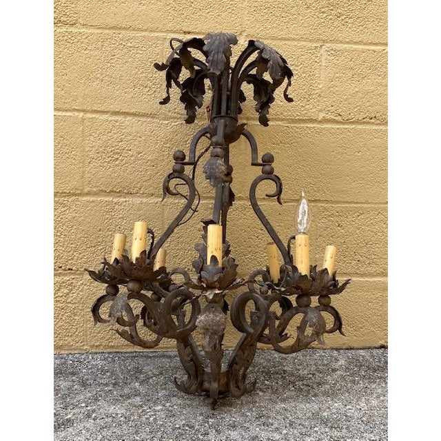 Spanish Mexican style detailed oxidized tin and wrought iron 8-candle chandelier; untouched rustic finish with vintage...