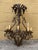 Spanish Mexican style detailed oxidized tin and wrought iron 8-candle chandelier; untouched rustic finish with vintage...