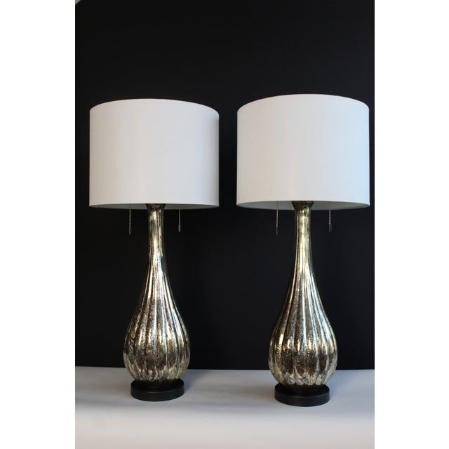 Beautiful pair of Avventurina influence mirrored lamps. Aged finish. Reeded glass giving more depth Gracious pair shape,...