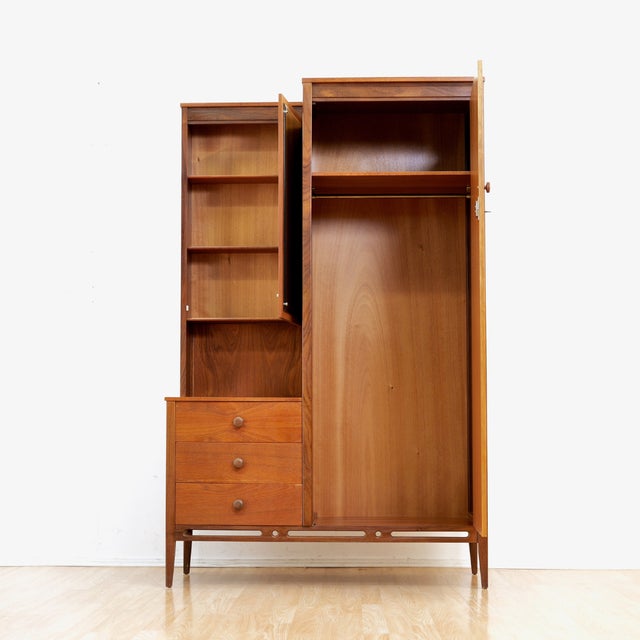 Mid-century modern gentleman’s compact wardrobe by Beithcraft Furniture, crafted in richly figured teak with elegant...