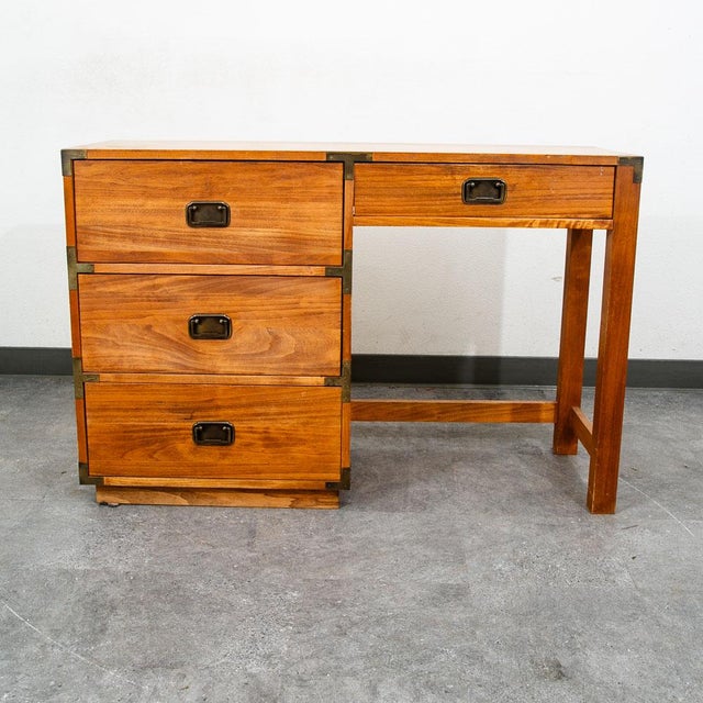 Campaign style office desk in wood and brass trim. wood frame with brass hinges and latch pulls. American design. Unmarked.