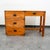 Campaign style office desk in wood and brass trim. wood frame with brass hinges and latch pulls. American design. Unmarked.