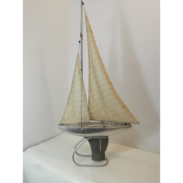 Beautiful and charming toy pond yacht sailboat from the 1950s. Made by Valberan Milano. Hull entirely made of aluminum and...