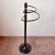 Vintage Italian freestanding umbrella stand or clothing valet stand. Made of heavy weighted black metal and brass accents,...