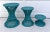 Here is a charming set of three wicker and cane stools that are painted in a fantastic teal blue. Each stool shares a...
