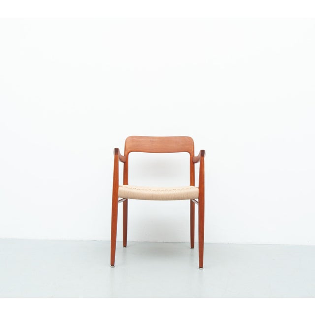 Two model 56 armchairs in solid teak. A classic, clean design with balanced proportions and high-quality craftsmanship....