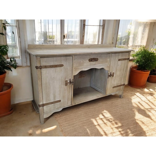 An antique Monterey sideboard/credenza from the early 1930s crafted by Mason Manufacturing of California. This sideboard...