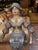 Antique 18th century or earlier European polychromed carved wooden female form with scroll work designed columnar base. It...