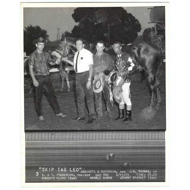 June 1965 black and white photograph of Judge Jr in the winner's circle at Marble Downs in Carthage, Missouri. African...