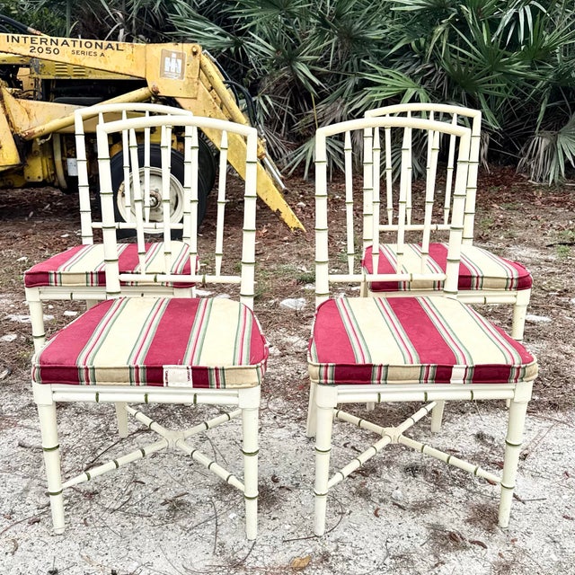 Charming set of four vintage coastal dining chairs crafted in a classic faux bamboo design. The frames feature turned...