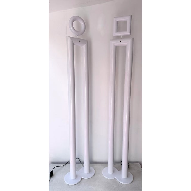 Rare pair of or set of 2 tall floor lamps Boy and Girl in white metal by the italian designer Remo Buti for the editor...