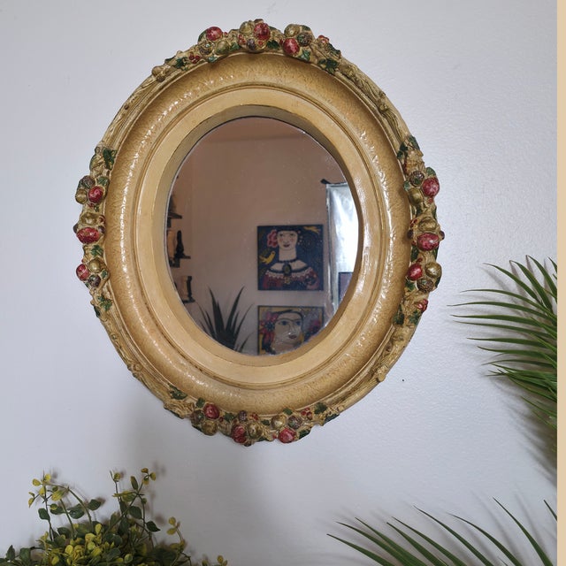 A jewel of Tuscan charm—this 16" vintage oval wall mirror features a fully polychrome gesso frame, richly painted with...