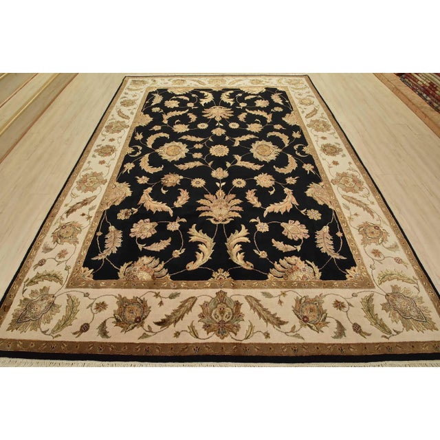 This traditional Agra rug is hand-knotted with a fine wool and silk pile on a cotton foundation. This rug is new and in...