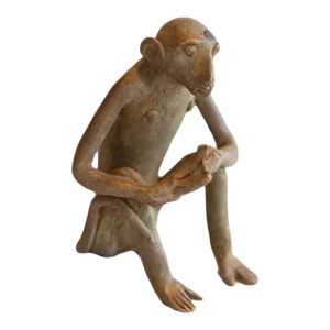 Vintage African Sitting Monkey With Banana Sculpture