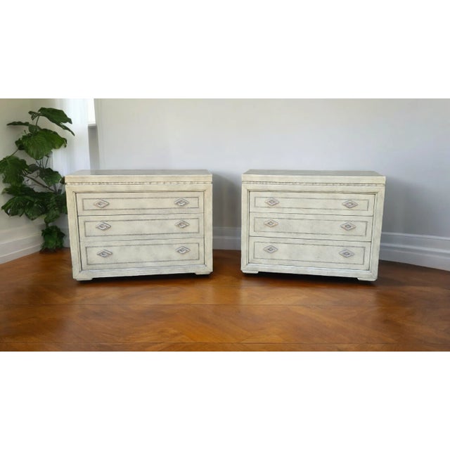 A sophisticated and exceptionally rare pair of Marge Carson leather-clad nightstands, beautifully crafted and fully...