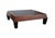 This low-profile square coffee table features a striking blend of rustic textures and clean, architectural lines. The...