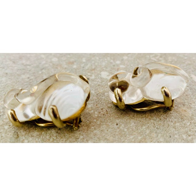 Just in time for gift giving- Mariquita Masterson’s one of a kind hand dripped glass ‘S’ earrings in honey, set in...