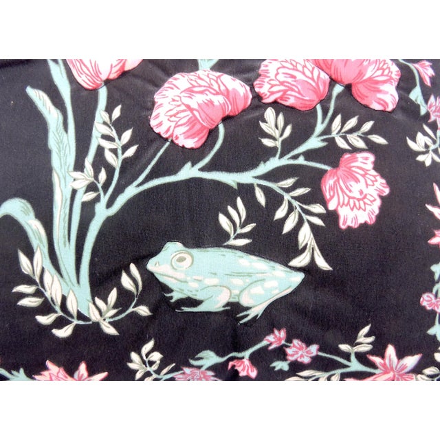 A pair of pretty floral pillows, black background with red tulips, red and white roses and a floral border. One cute...