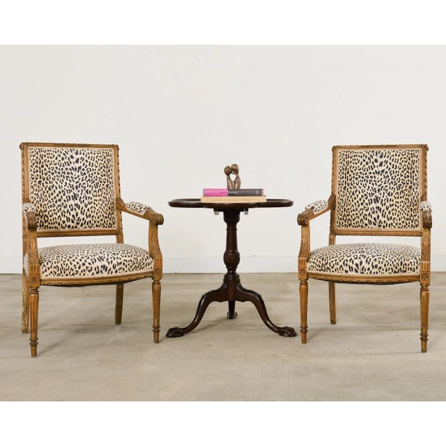 Handsome English mahogany flip-top side, end, or dessert table featuring a clover leaf shaped top. The top is supported by...