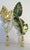 Unique pair of vintage Italian Gold Leaf Tole Finials set in brass bases. Triple set of leaves reaches upward to reflect...