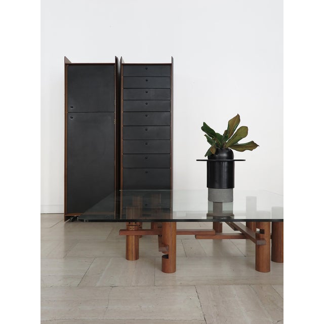 Large low centerpiece table designed by Theodore Waddell and produced by Bernini, featuring a sculptural solid wood base...