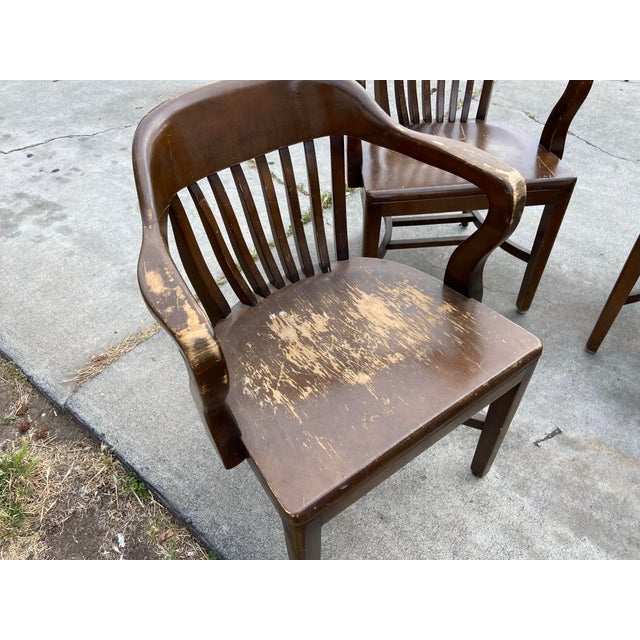 The product is a set of 5 antique walnut court lawyers desk chairs from the 1920s-194Os, featuring good bones in need of...