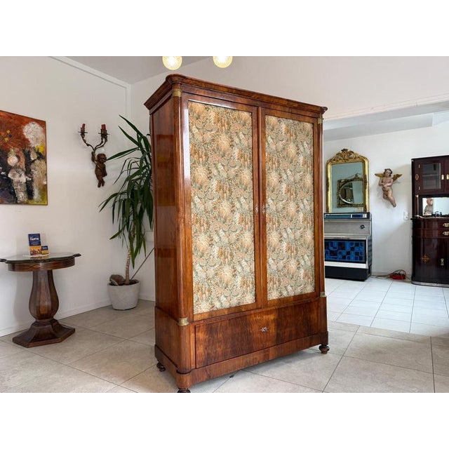 Charming original 2-door Biedermeier wardrobe, circa 1840. Dimensions: Height x Width x Depth (cornice dimensions) 196 x...