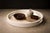 Executed in the historic maque lacquer tradition of Olinalá, Guerrero, this circular tray reflects a lineage of Mexican...