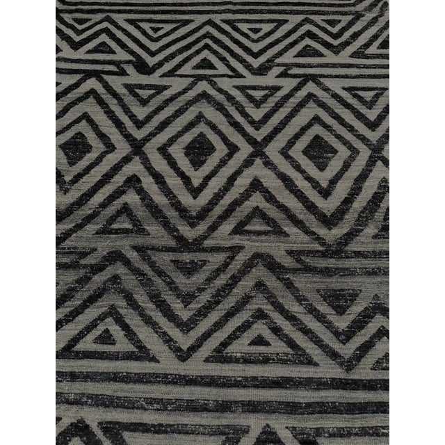 Hand knotted of top quality natural dyed wool and cotton in Afghanistan. This unique and innovative Navajo style Rug is an...