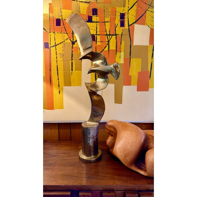 Mid century brass sculpture of a bird in flight. Sits on an attached brass base. Designed by Hattakitkosol Somchai. He was...