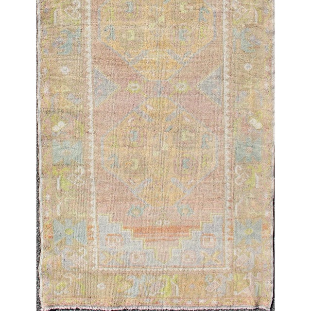 Light Blue, Yellow, light Brown, light gray blue, light green and multi colors vintage Turkish Oushak runner with...
