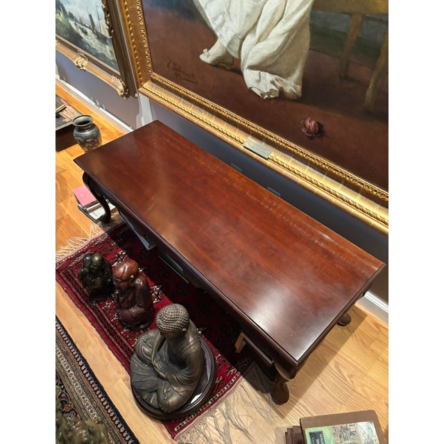 Queen Anne style cherry wood coffee table with cabriole legs. MInor scratches on surface. Unknown manufacturer. Believed...